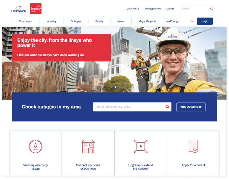 Utility workers standing in a city street, featured on a website homepage with an outage search bar.