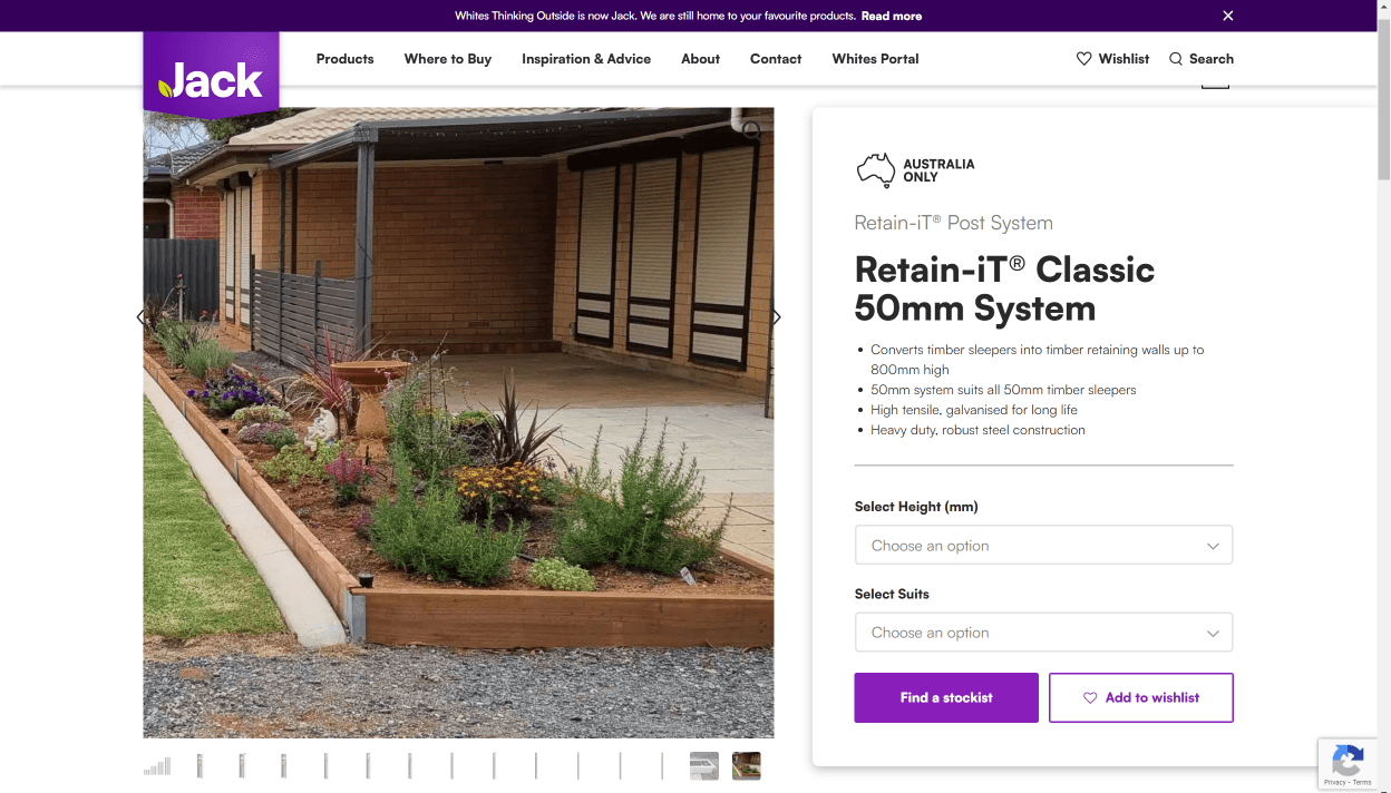 Outdoor garden bed built with timber sleepers using the Retain-iT Classic 50mm Post System, shown next to a brick home with landscaped plants and a paved patio.