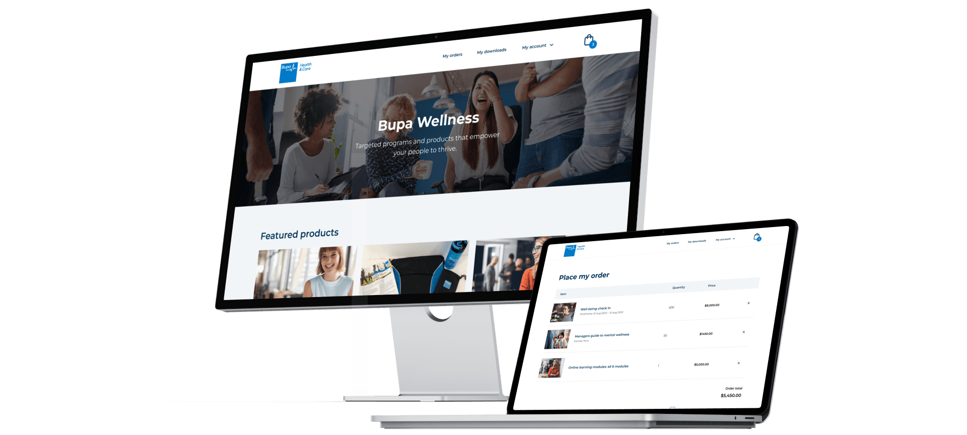 Laptop and desktop with bupa website displayed